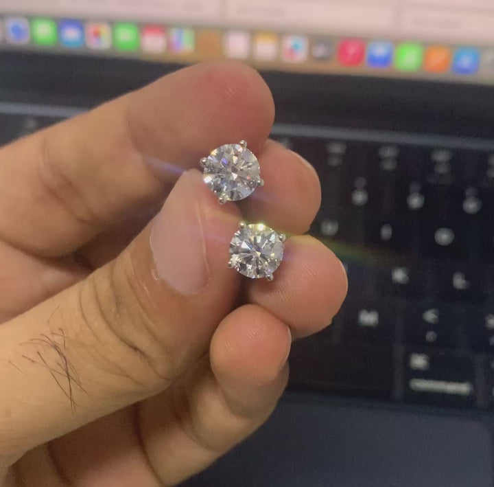 Real-time video of Lab Grown Diamond Stud Earrings, displaying their natural sparkle and flawless craftsmanship as light reflects off the diamonds in various angles, emphasizing the elegance and brilliance of the earrings.