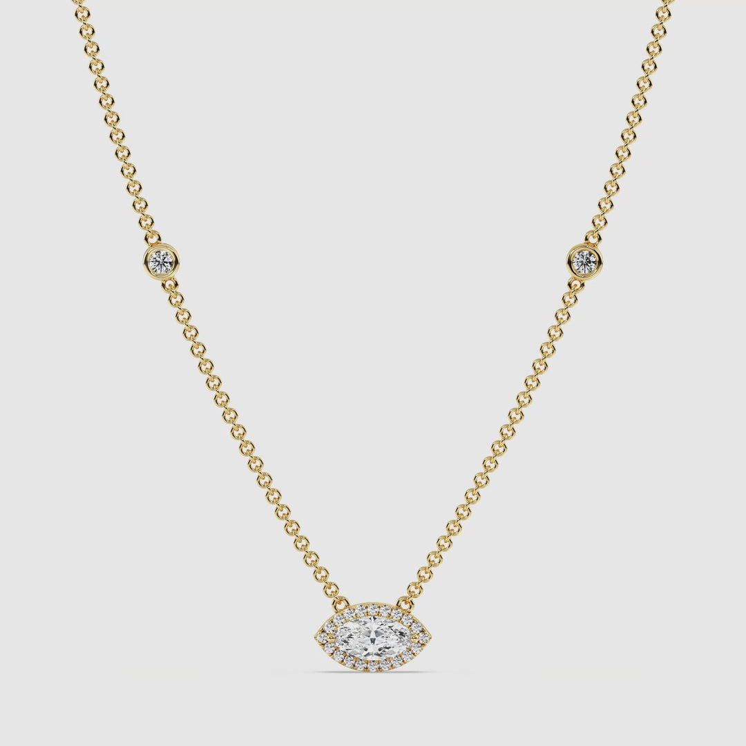 Video showcasing the Elegant Marquise Diamond Bezel Station Necklace in 18K Yellow Gold