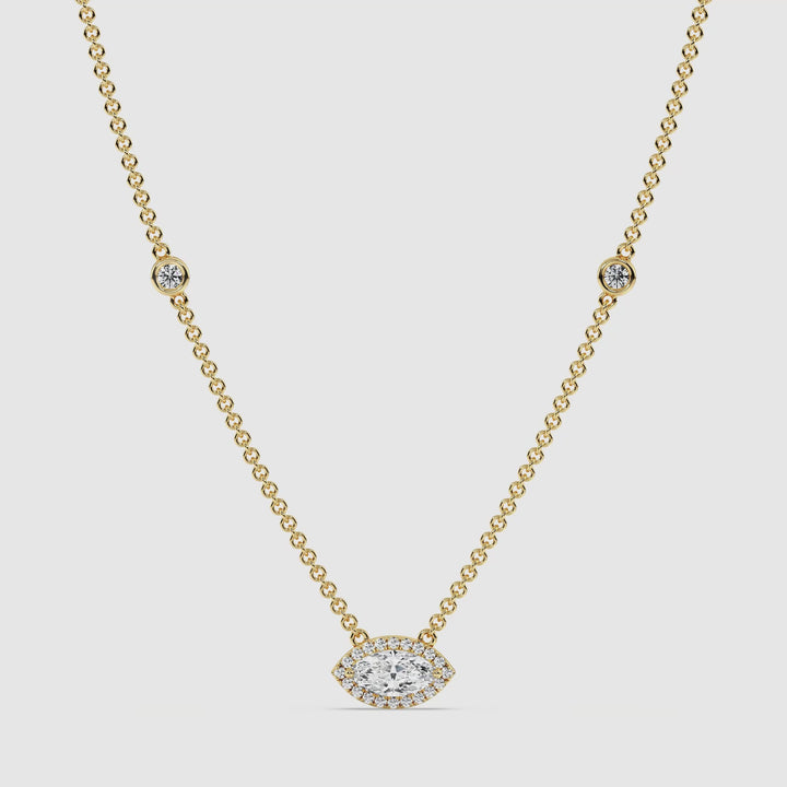 Video showcasing the Elegant Marquise Diamond Bezel Station Necklace in 18K Yellow Gold