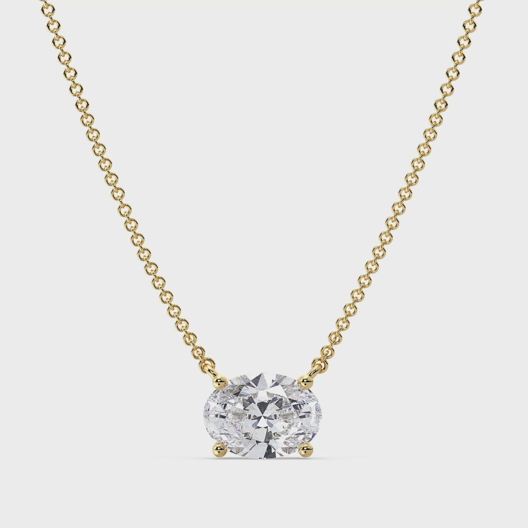 Close-up view of the 2.00 Carat Oval Lab-Grown Diamond Solitaire Necklace in 18K Yellow Gold, featuring an IGI Certified E/VS oval-cut diamond set in a prong setting, showcasing its brilliance and elegance.