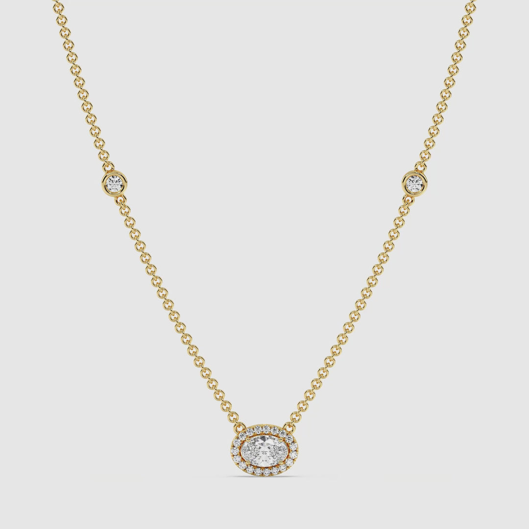 Video showcasing the Elegant Oval Diamond Bezel Station Necklace in 18K Yellow Gold