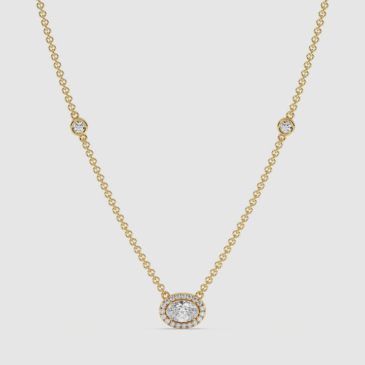 Video showcasing the Elegant Oval Diamond Bezel Station Necklace in 18K Yellow Gold