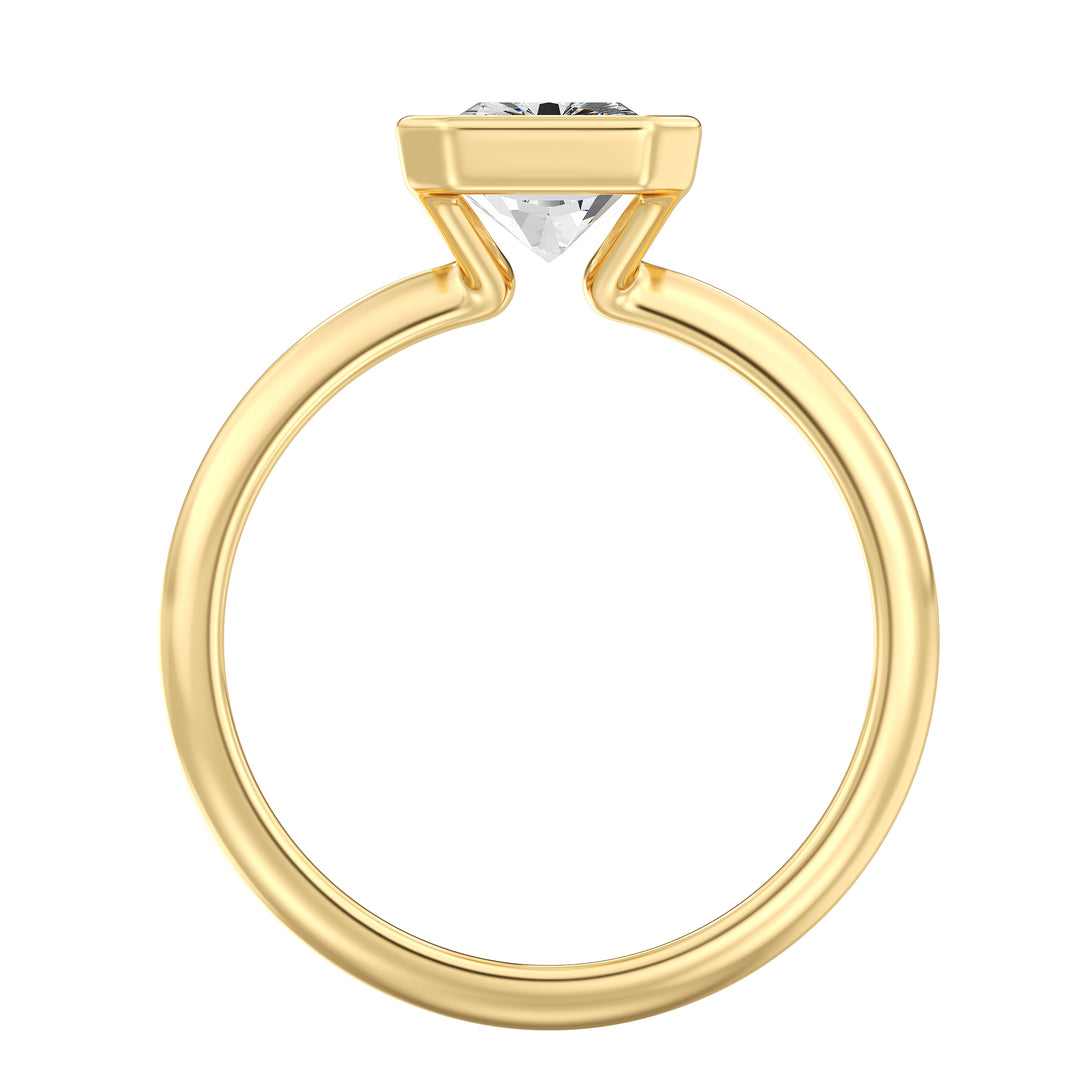 Side view of a radiant cut lab grown diamond bezel solitaire ring in 18K yellow gold highlighting brilliant faceting and a secure bezel setting.