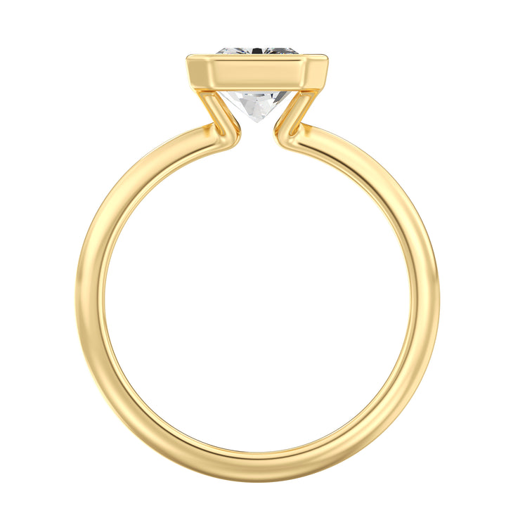 Side view of a radiant cut lab grown diamond bezel solitaire ring in 18K yellow gold highlighting brilliant faceting and a secure bezel setting.