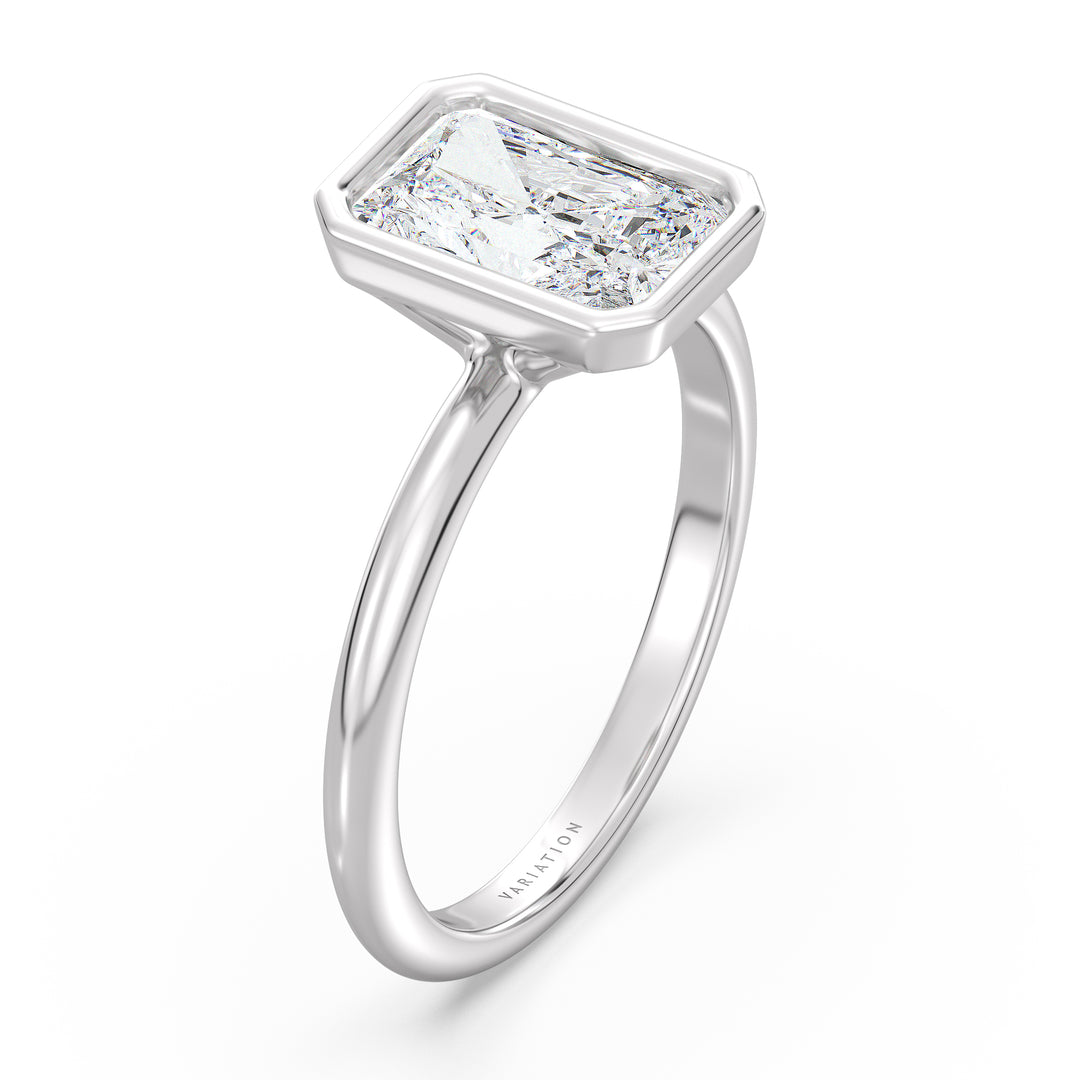 Radiant cut lab grown diamond bezel solitaire ring in 18K white gold with an IGI certified diamond and sleek contemporary bezel design.