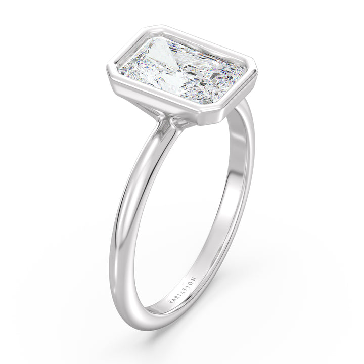 Radiant cut lab grown diamond bezel solitaire ring in 18K white gold with an IGI certified diamond and sleek contemporary bezel design.