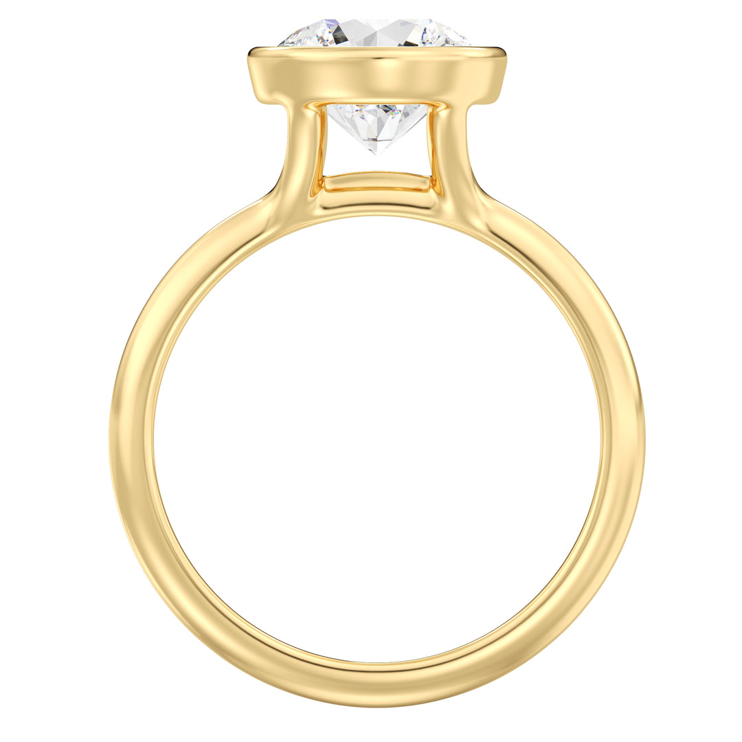 Round brilliant cut lab grown diamond ring in 18K yellow gold showcasing exceptional sparkle, fire, and a secure bezel setting.