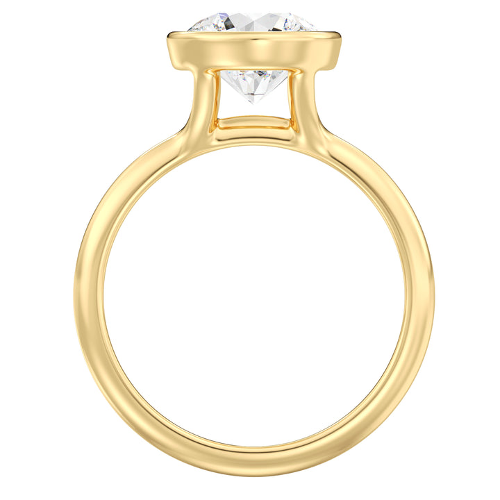 Round brilliant cut lab grown diamond ring in 18K yellow gold showcasing exceptional sparkle, fire, and a secure bezel setting.