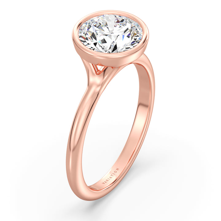 Round brilliant cut lab grown diamond bezel solitaire ring in 18K rose gold featuring an IGI certified diamond with a protective bezel setting and exceptional brilliance.