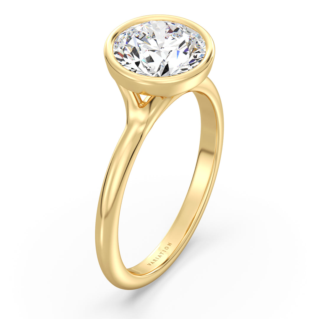 Round brilliant cut lab grown diamond bezel solitaire ring in 18K yellow gold featuring an IGI certified diamond with a modern bezel setting.