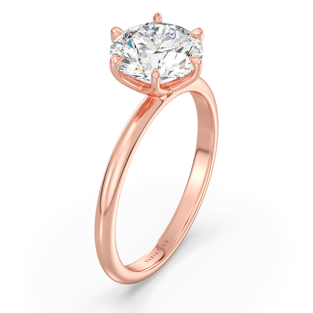 Round brilliant cut lab grown diamond solitaire ring in 18K rose gold featuring an IGI certified diamond with an elegant open basket setting.