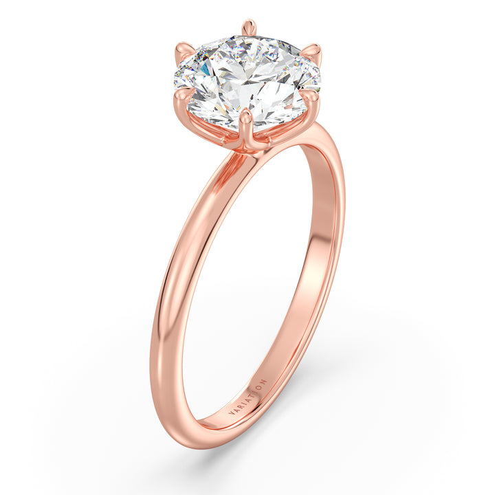 Round brilliant cut lab grown diamond solitaire ring in 18K rose gold featuring an IGI certified diamond with an elegant open basket setting.