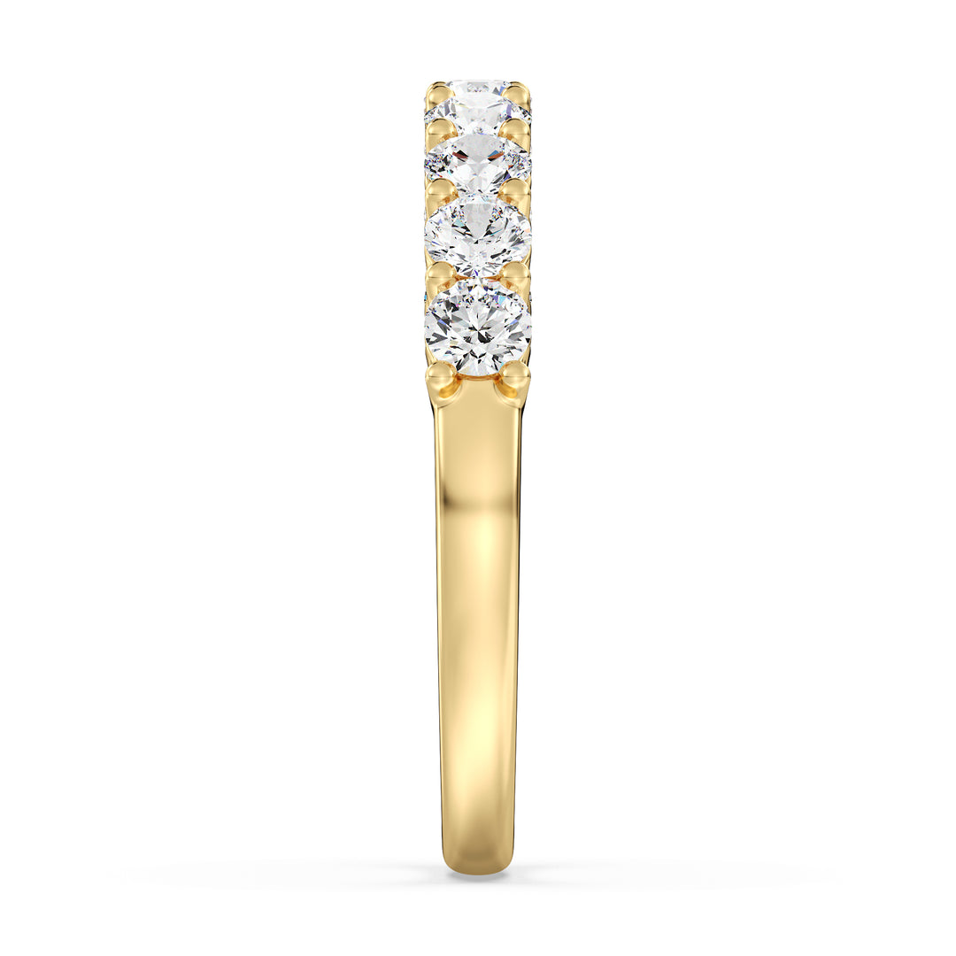 Round brilliant lab grown diamond wedding band in 18K yellow gold showcasing continuous sparkle across a classic 9 stone design.