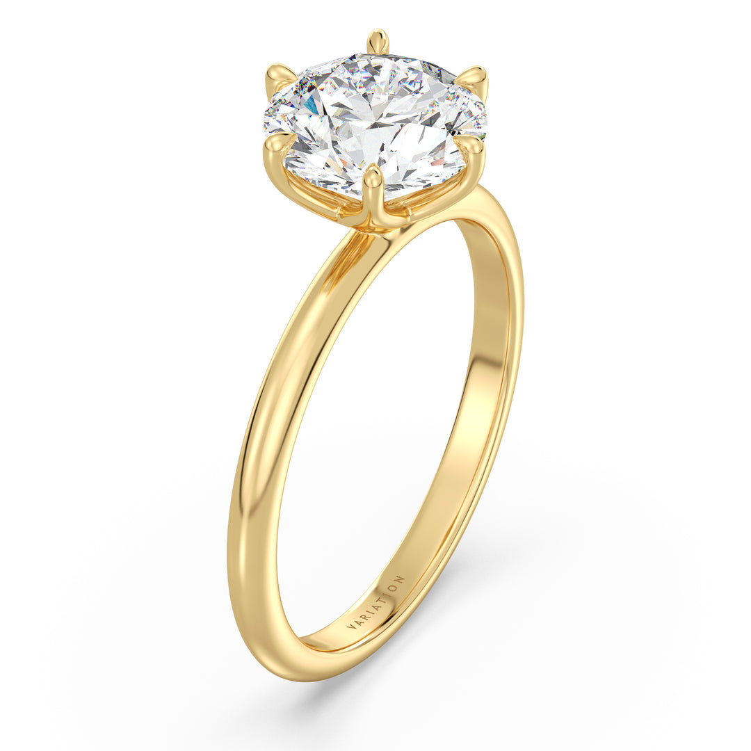 Elegant round brilliant cut lab grown diamond solitaire ring crafted in 18K yellow gold with exceptional sparkle and timeless design.
