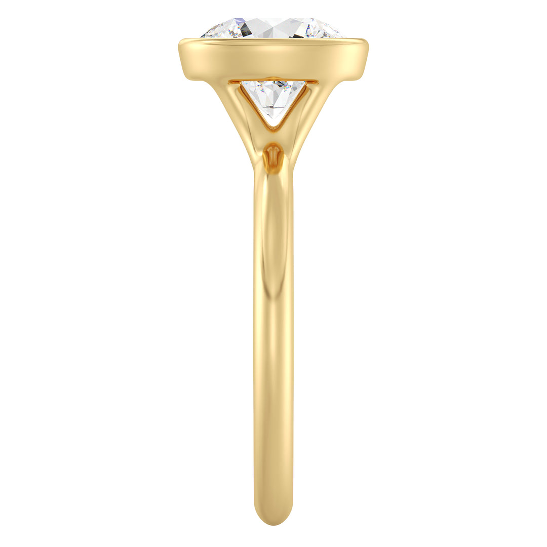 IGI certified round brilliant cut lab grown diamond bezel solitaire ring in BIS hallmarked 18K yellow gold.