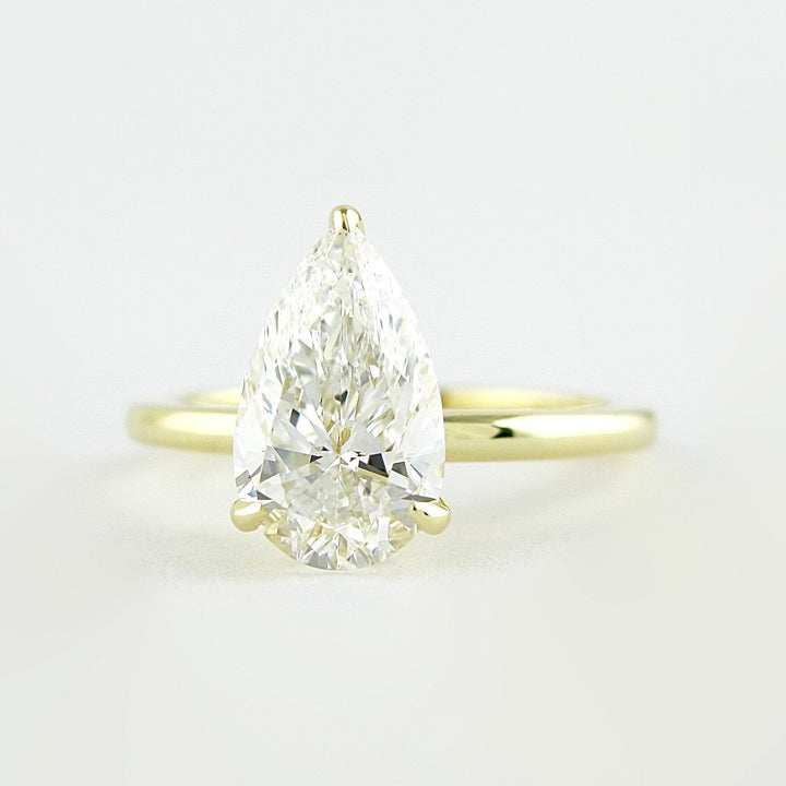 1.5 CT Pear Cut Solitaire Style Moissanite Engagement Ring